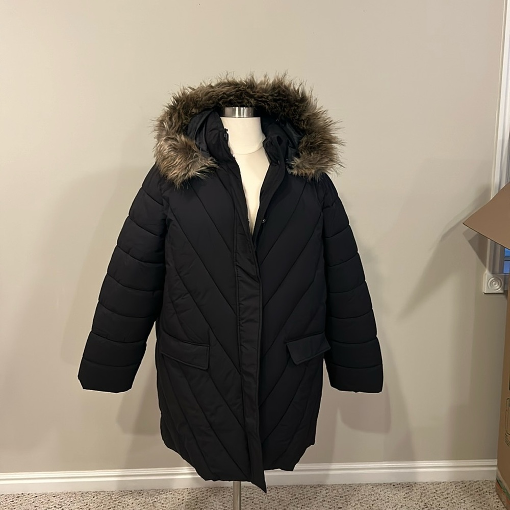 NWT/ Plus size long puffer jacket with faux fur trimmed hood.